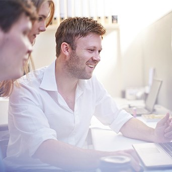 A group of People Discussing Plans - Hybrid Cloud - Infront